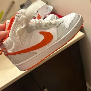 Nike high tops grey white and orange